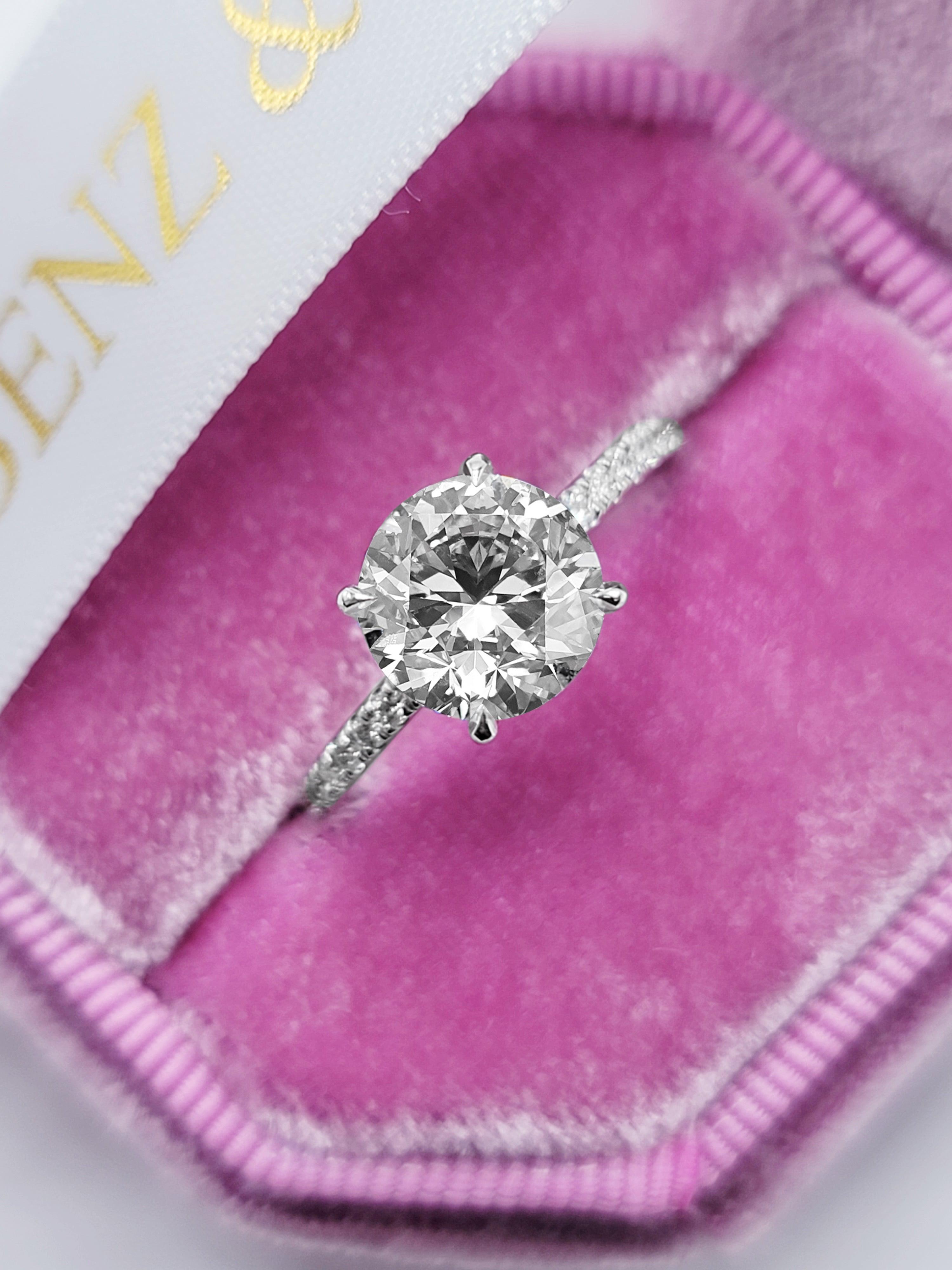 DB Classic round brilliant and pear-shaped diamond ring