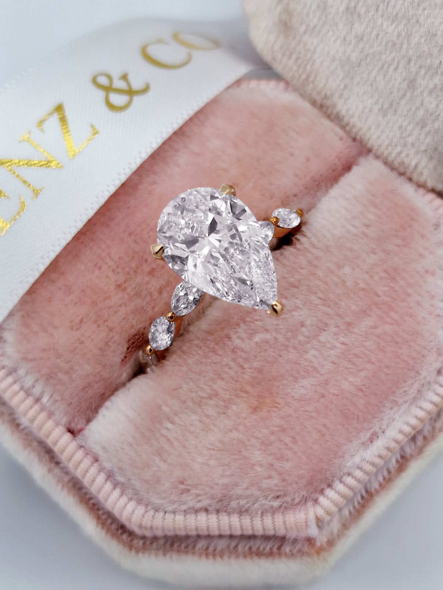 4.08 Carats Lab Grown Pear Shaped with Marquise Side Stones Hidden Halo Diamond Engagement Ring